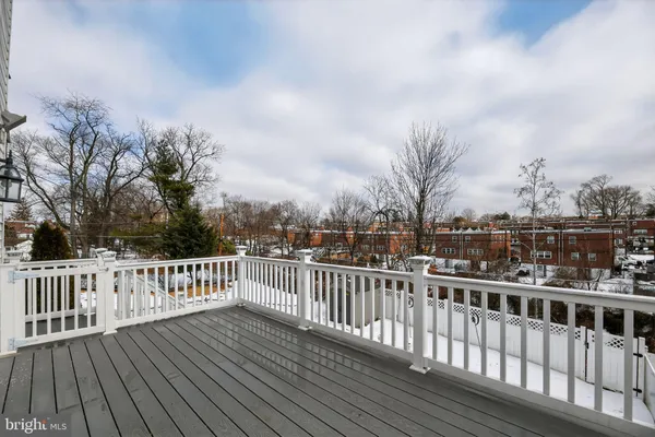 a view of a balcony with wooden fence