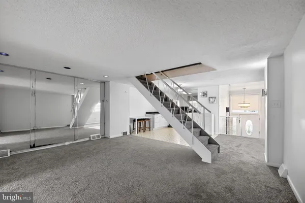 a view of a livingroom with stairs and stairs