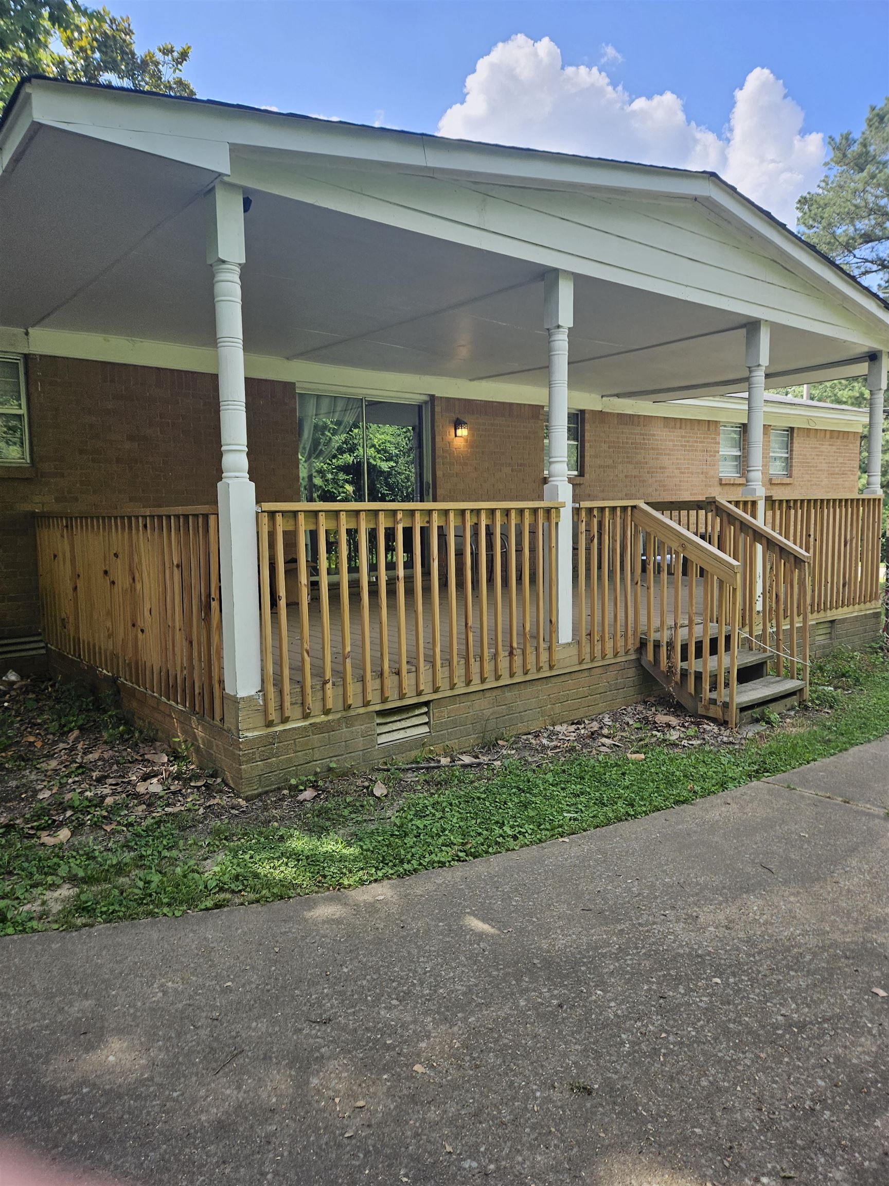 273 North Main Street Ripley, TN 38063 - Photo 14 of 15 a view of a house with a yard and a bench