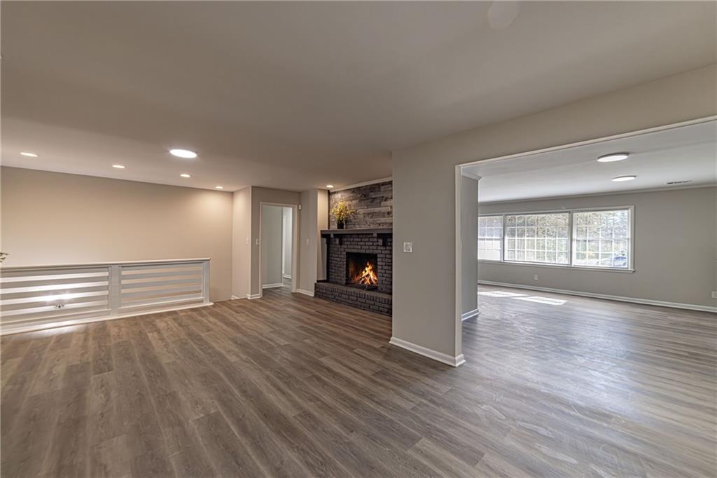 2362 Springrun Court Decatur, GA 30032 - Photo 21 of 83 a view of an empty room with wooden floor fireplace and a window