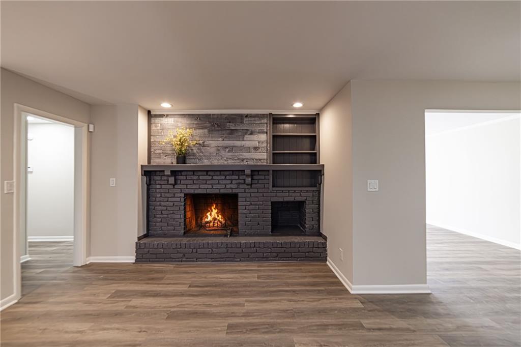 2362 Springrun Court Decatur, GA 30032 - Photo 23 of 83 a view of empty room with wooden floor and fireplace