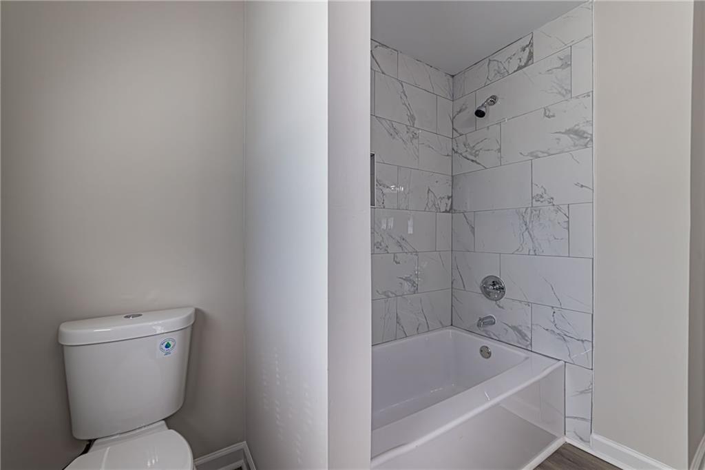 2362 Springrun Court Decatur, GA 30032 - Photo 35 of 83 a white toilet sitting next to a bath tub