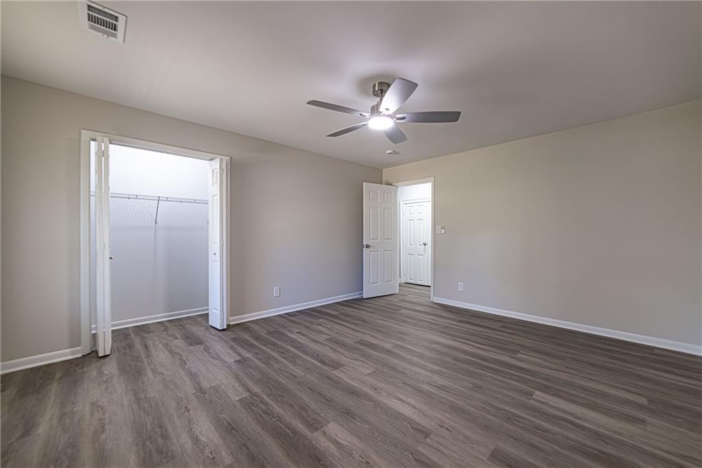 2362 Springrun Court Decatur, GA 30032 - Photo 38 of 83 an empty room with wooden floor and windows