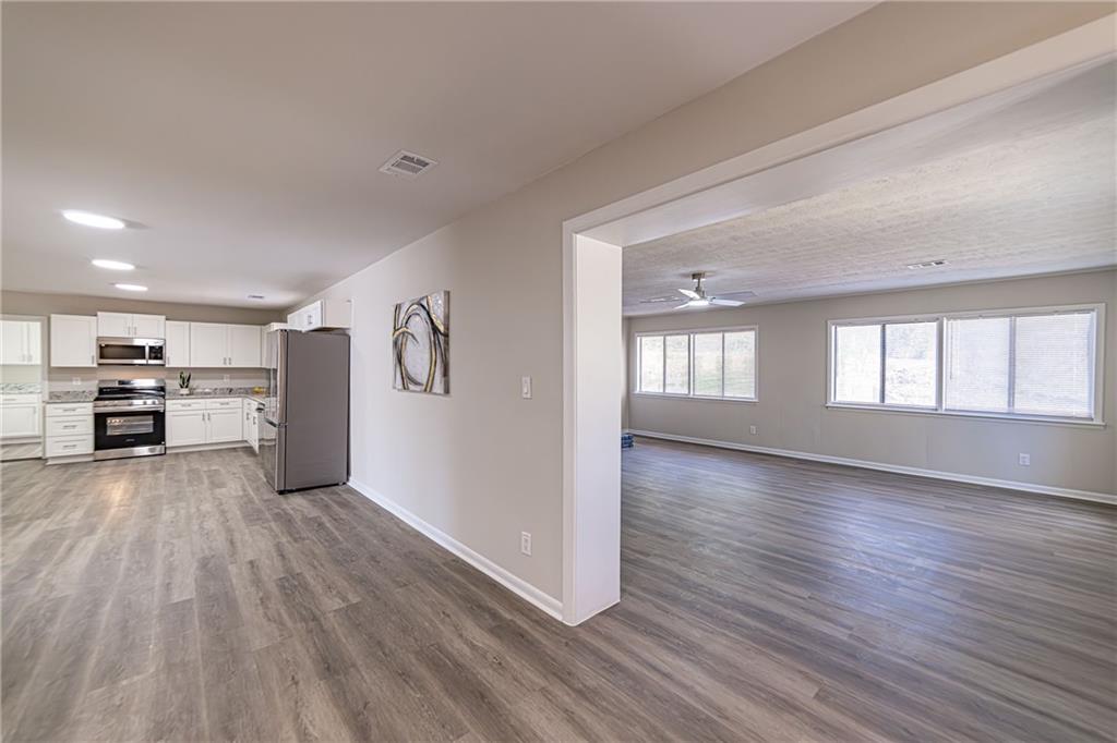 2362 Springrun Court Decatur, GA 30032 - Photo 56 of 83 a view of a kitchen with a sink cabinets and a living room