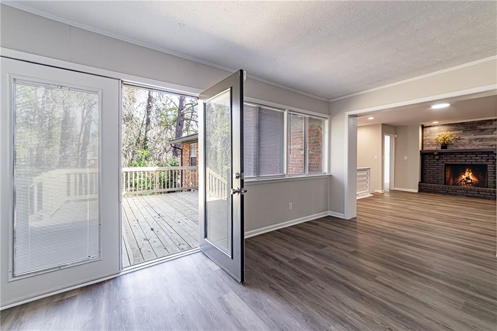 2362 Springrun Court Decatur, GA 30032 - Photo 63 of 83 a view of empty room with wooden floor and fireplace