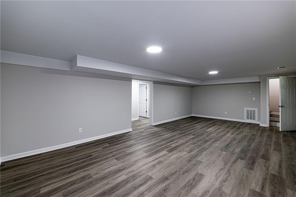 2362 Springrun Court Decatur, GA 30032 - Photo 68 of 83 a view of an empty room and wooden floor