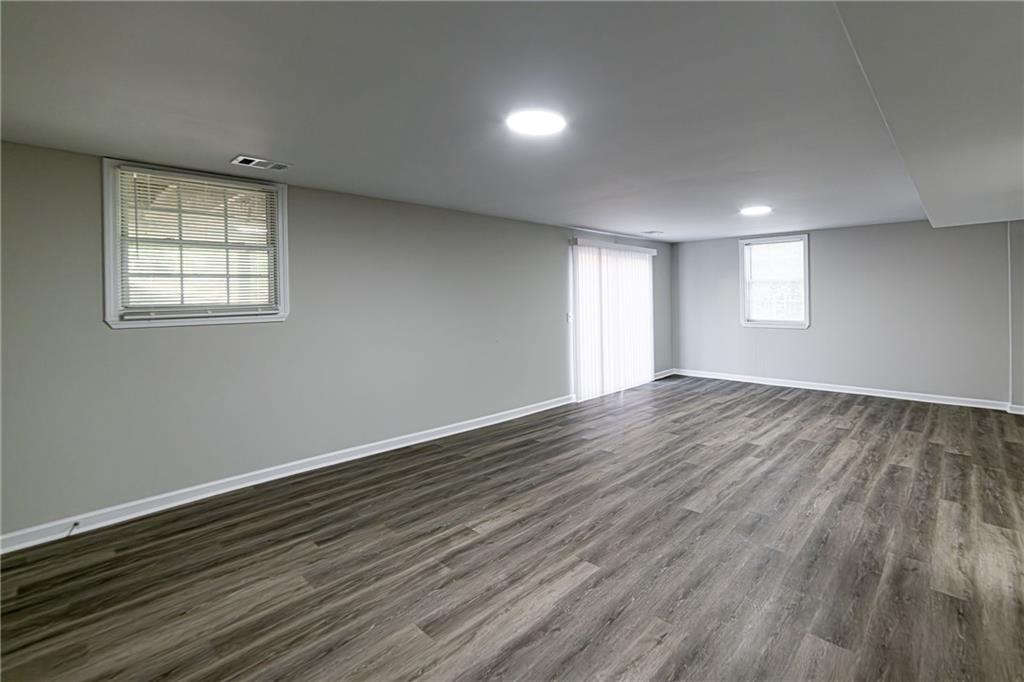 2362 Springrun Court Decatur, GA 30032 - Photo 70 of 83 an empty room with wooden floor and windows