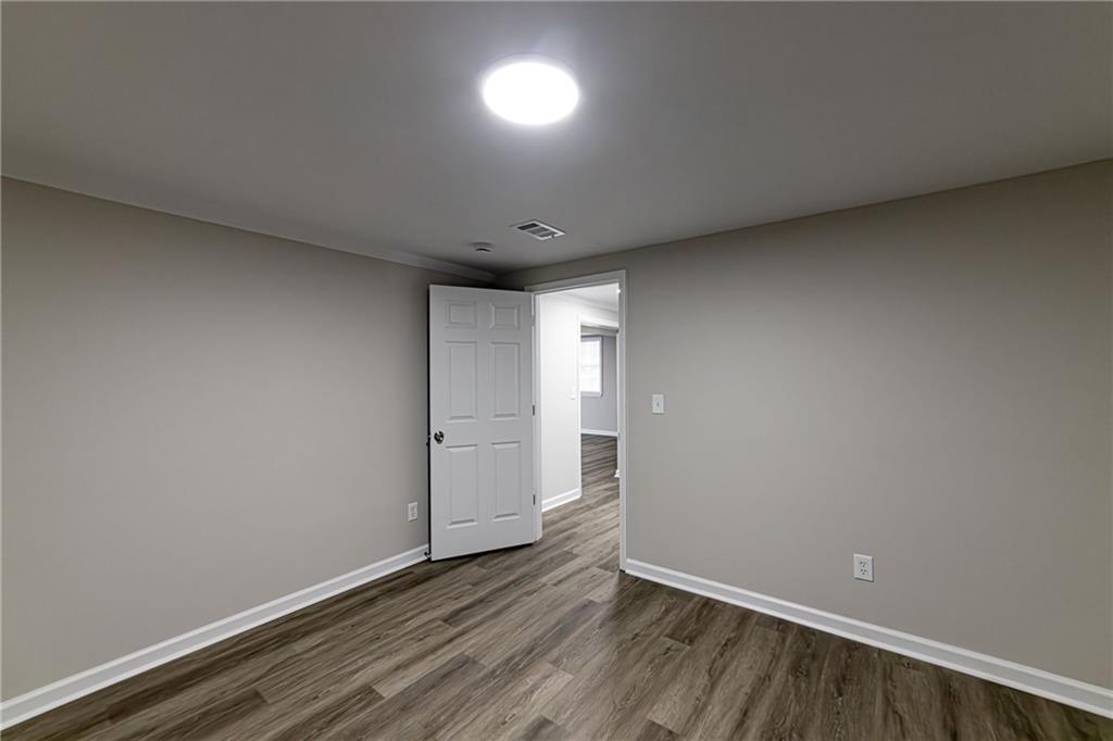 2362 Springrun Court Decatur, GA 30032 - Photo 80 of 83 a view of an empty room and wooden floor