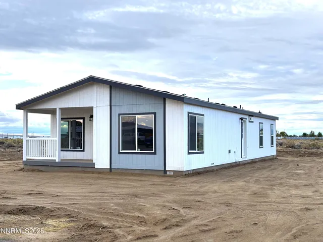 front view of a house with a large window
