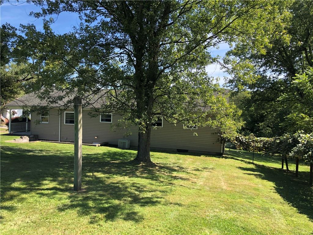1277 Harrison City Export Road Jeannette, PA 15644 - Photo 12 of 17 a swimming pool with trees in the background