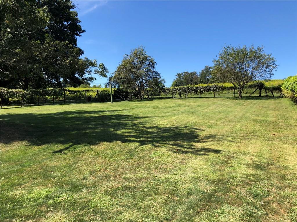 1277 Harrison City Export Road Jeannette, PA 15644 - Photo 15 of 17 a view of a swimming pool with an outdoor space and seating area