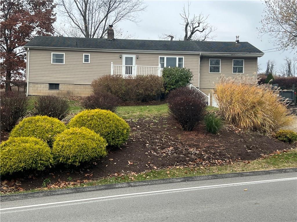 1277 Harrison City Export Road Jeannette, PA 15644 - Photo 17 of 17 a front view of a house with garden