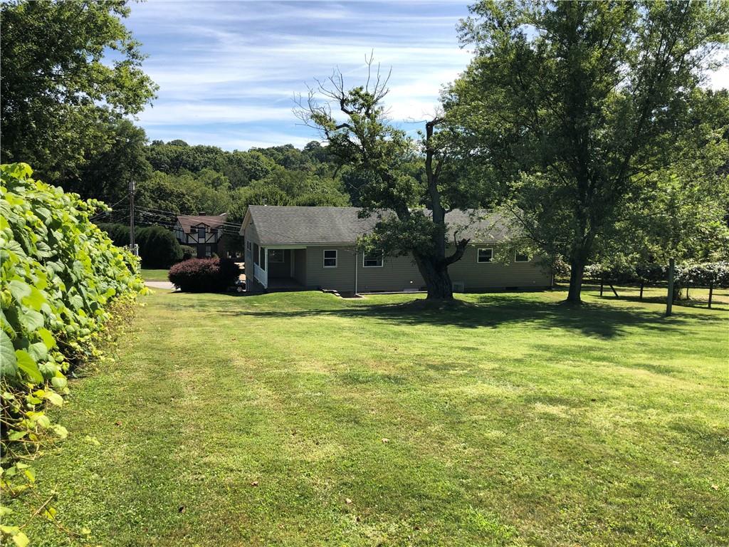 1277 Harrison City Export Road Jeannette, PA 15644 - Photo 2 of 17 a view of a house with a yard