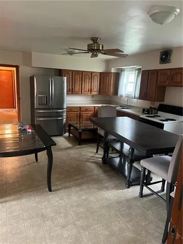 a room with furniture pool table and flat screen tv