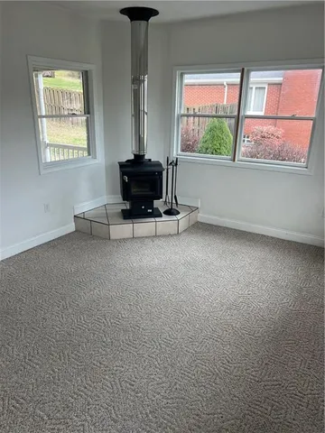 a view of work space with wooden floor and windows