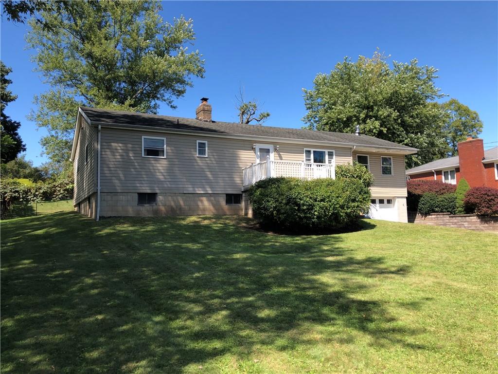 1277 Harrison City Export Road Jeannette, PA 15644 - Photo 9 of 17 a view of a house with a yard