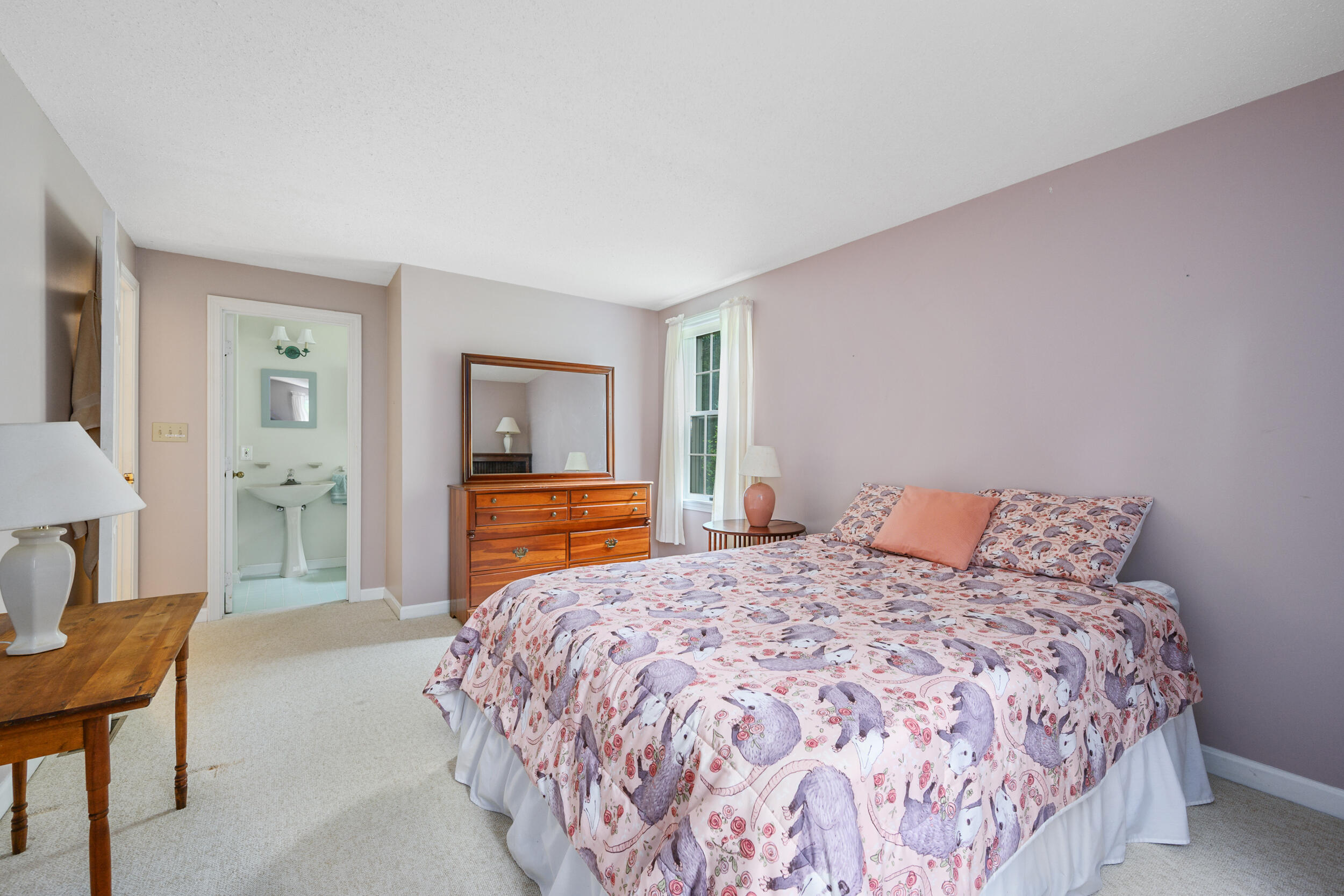 75 Old Toll Road West Barnstable, MA 02668 - Photo 18 of 28 a bedroom with a large bed and a chandelier
