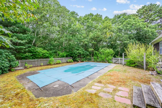 a view of a swimming pool with an outdoor space and seating area