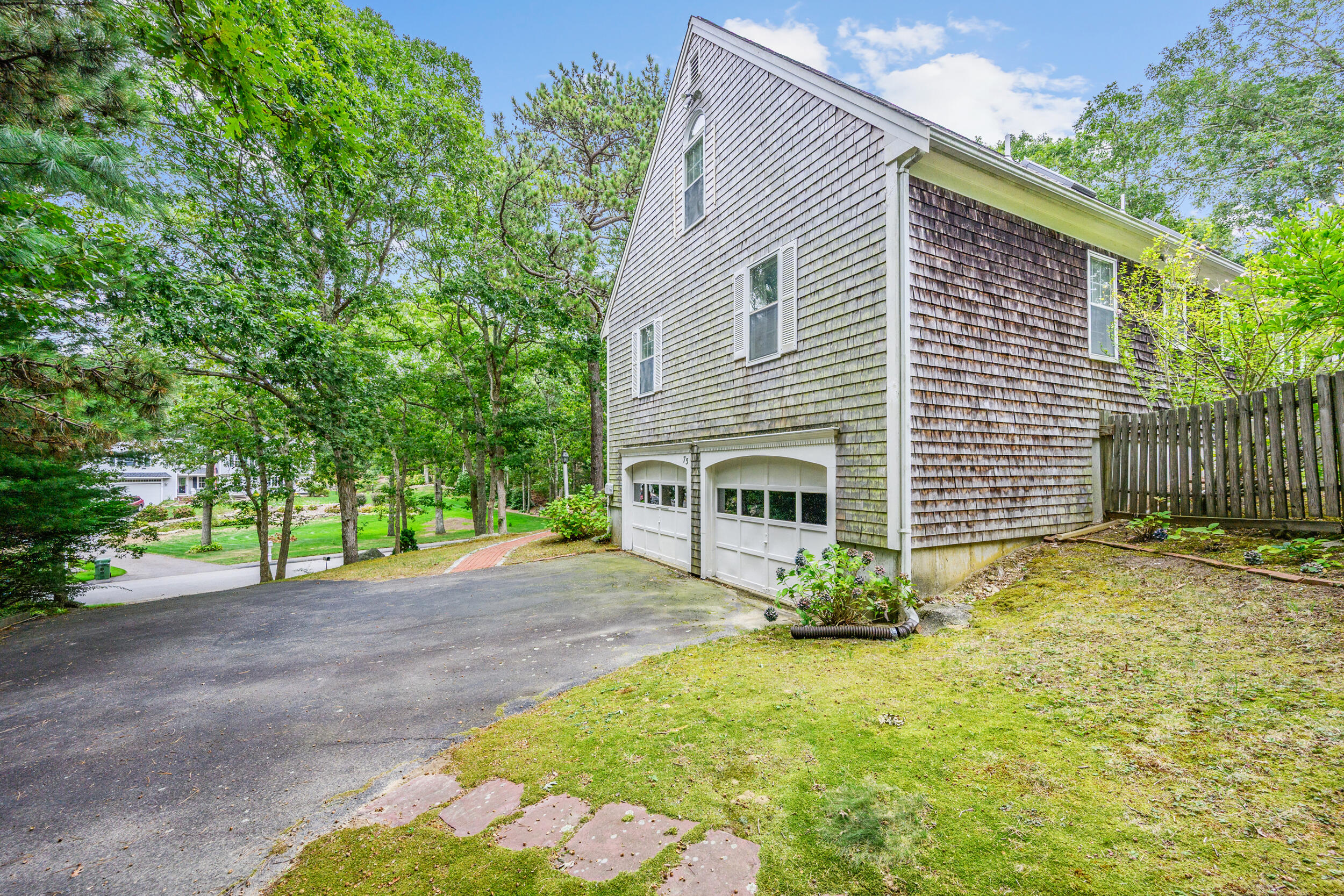 75 Old Toll Road West Barnstable, MA 02668 - Photo 27 of 28 a view of a house with backyard and a tree
