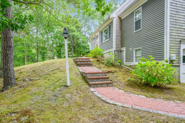a view of a backyard with chairs