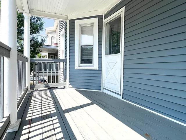 a view of a balcony with wooden floor