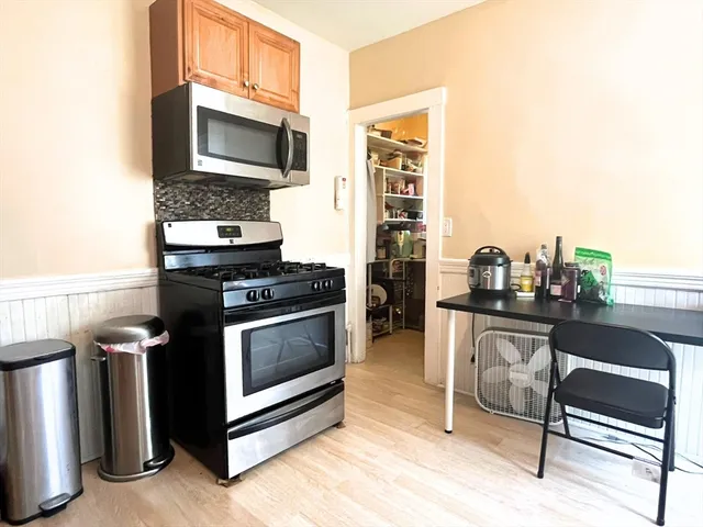 a kitchen with a stove and a microwave