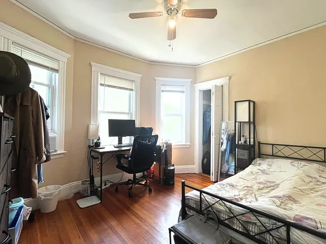 a workspace with furniture window and wooden floor