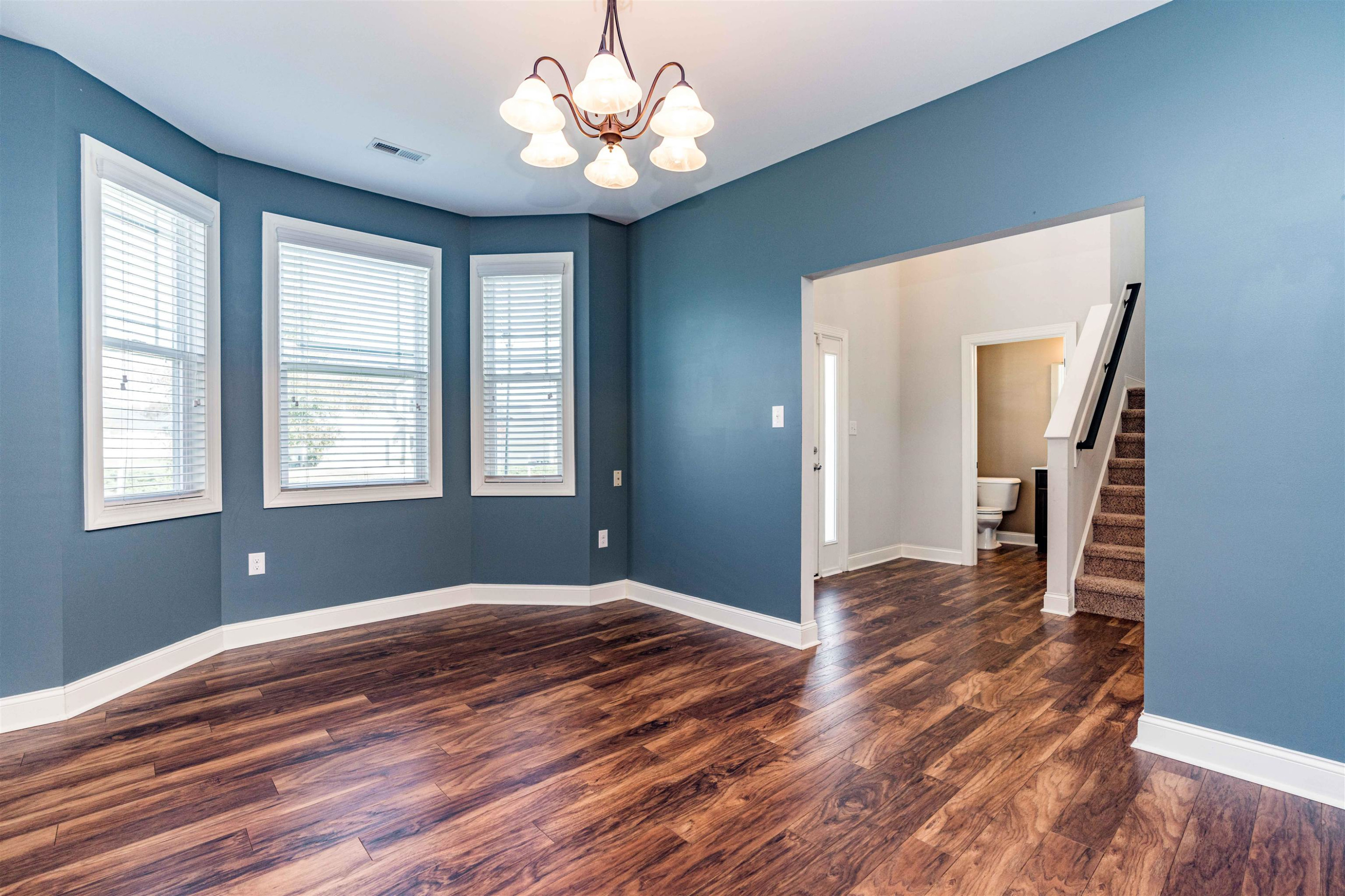 118 Colson Drive Garner, NC 27529 - Photo 21 of 47 a view of empty room with wooden floor and fan