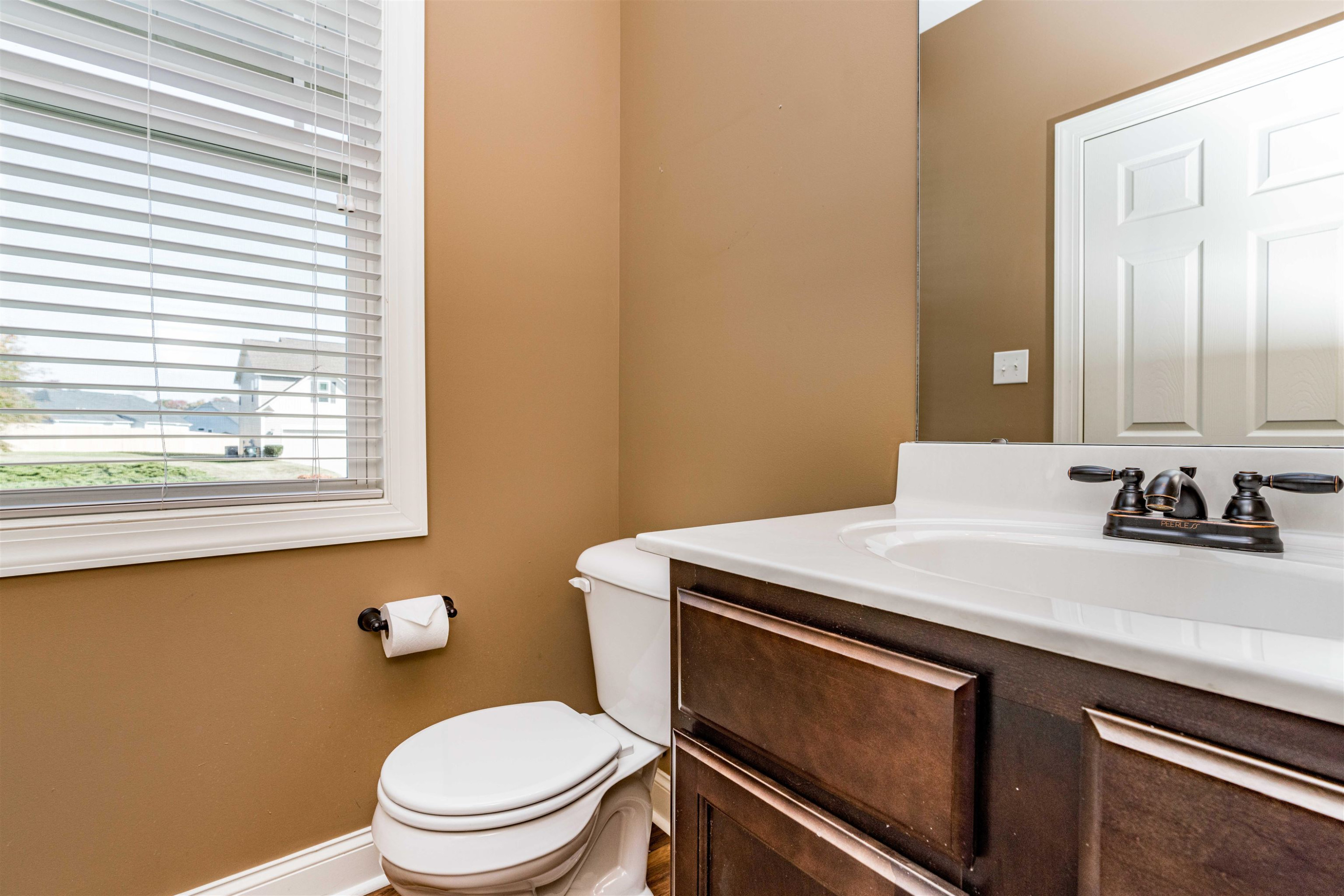 118 Colson Drive Garner, NC 27529 - Photo 23 of 47 a bathroom with a sink a toilet and a mirror
