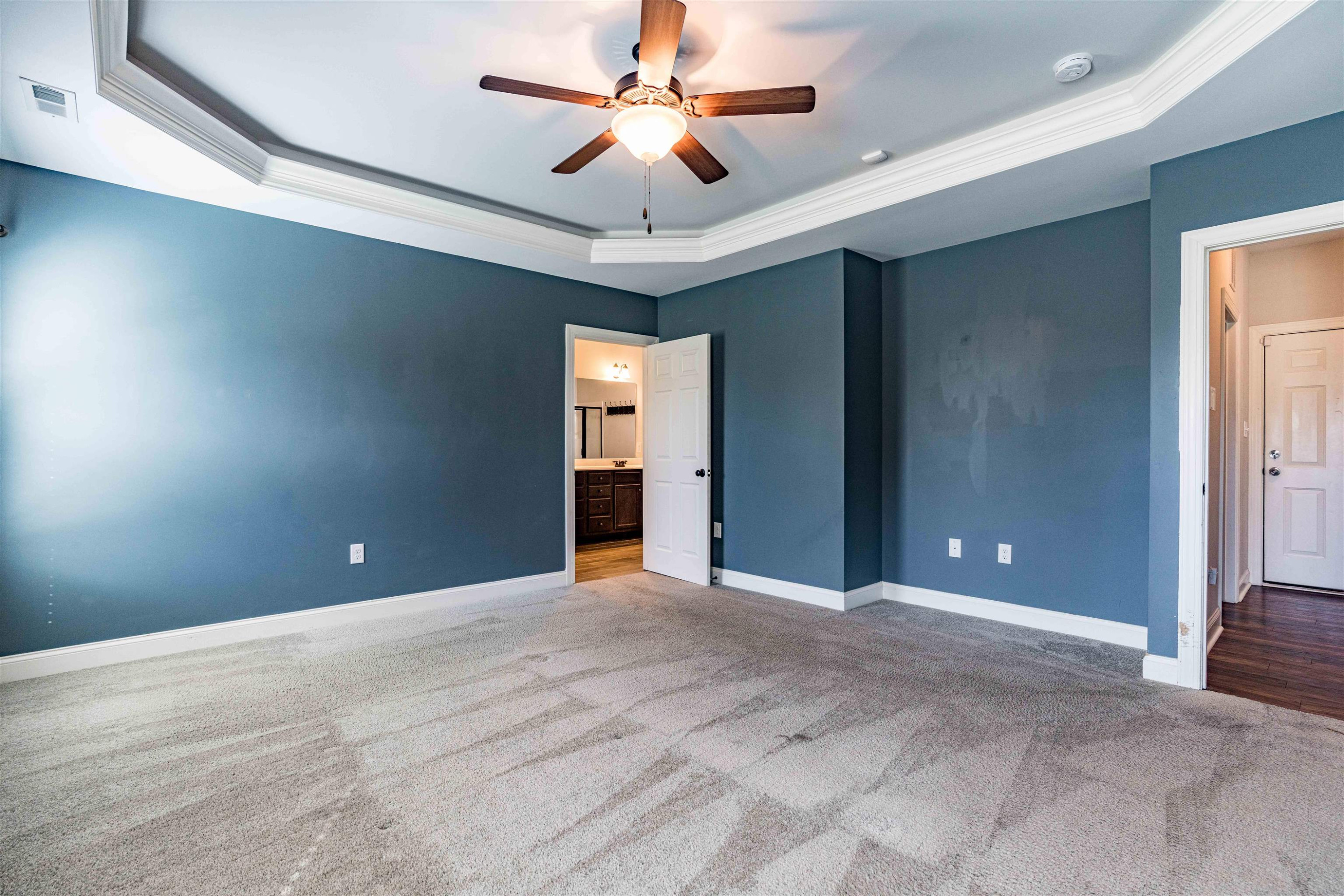 118 Colson Drive Garner, NC 27529 - Photo 25 of 47 a view of an empty room with a ceiling fan