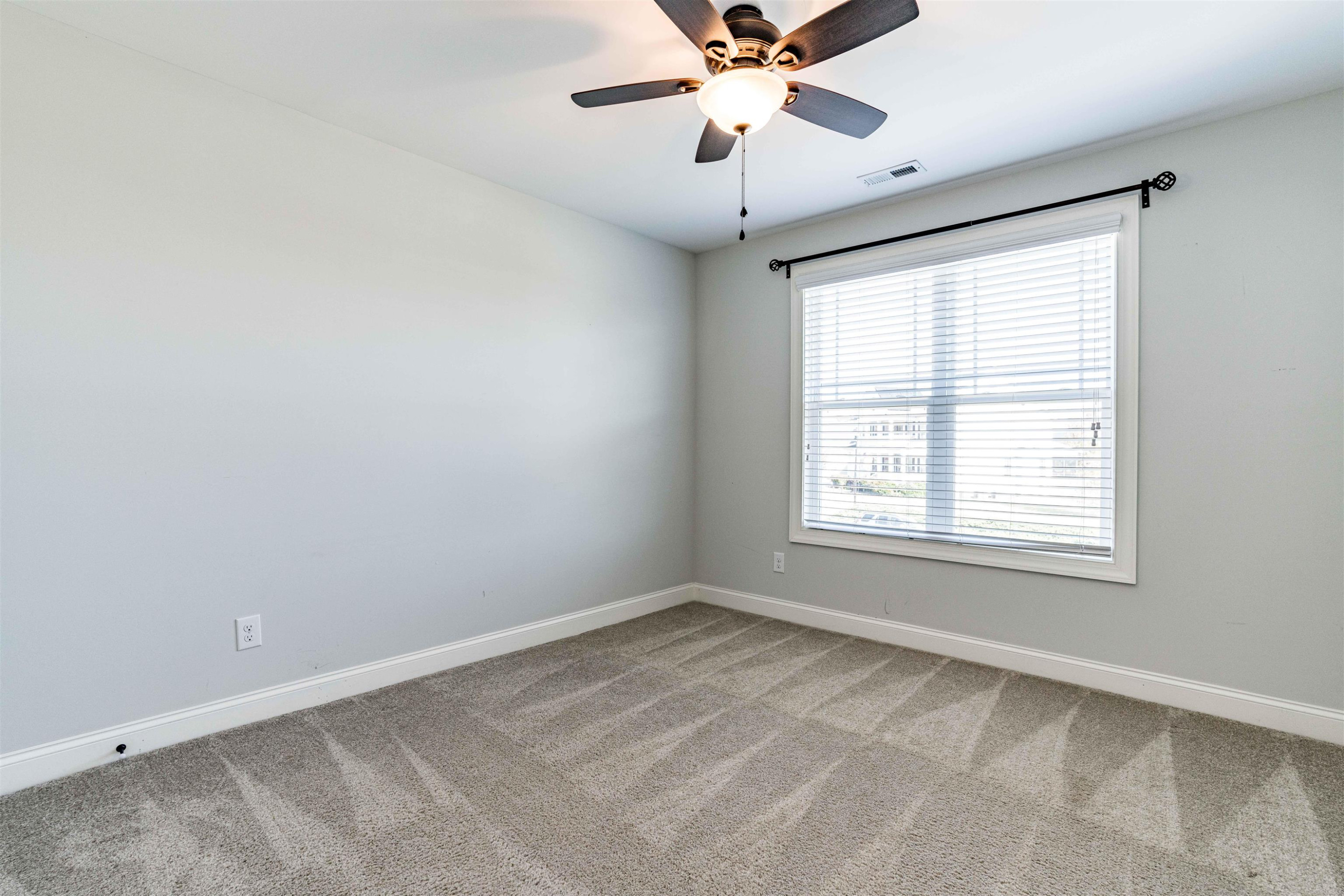 118 Colson Drive Garner, NC 27529 - Photo 31 of 47 a view of an empty room with a window