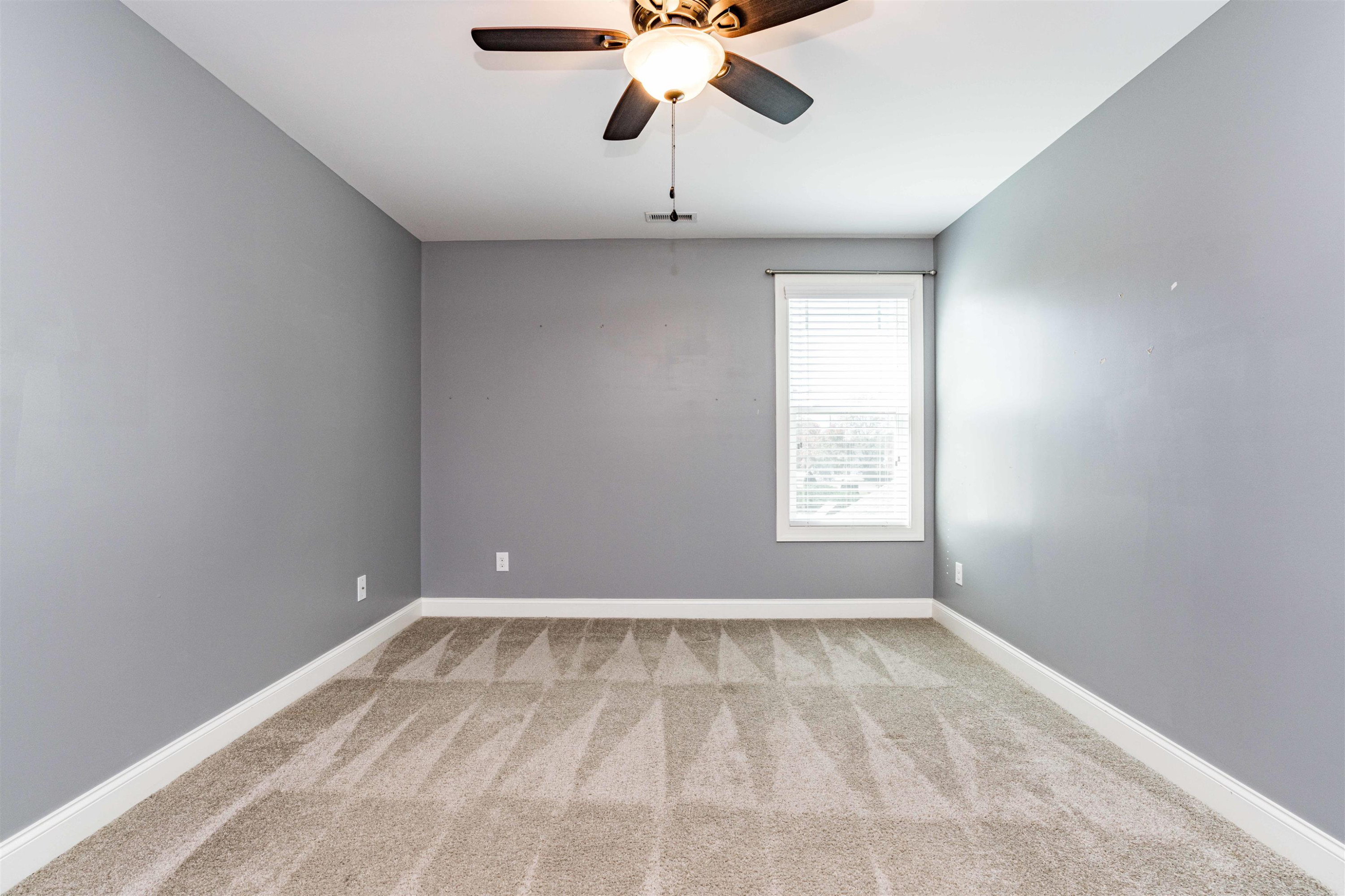 118 Colson Drive Garner, NC 27529 - Photo 36 of 47 a view of room with window and ceiling fan