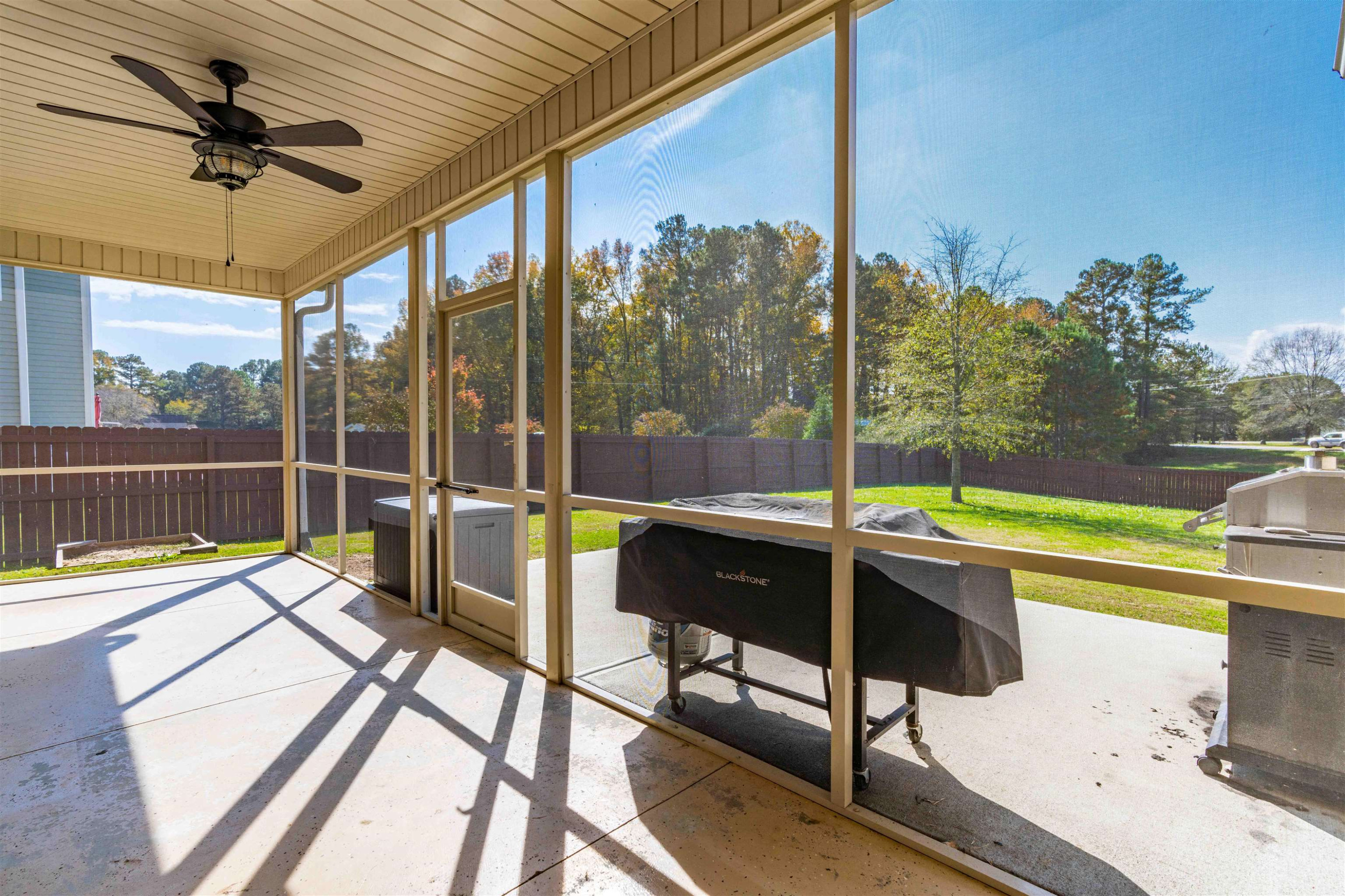 118 Colson Drive Garner, NC 27529 - Photo 41 of 47 a view of a swimming pool with a chair and tables in the patio