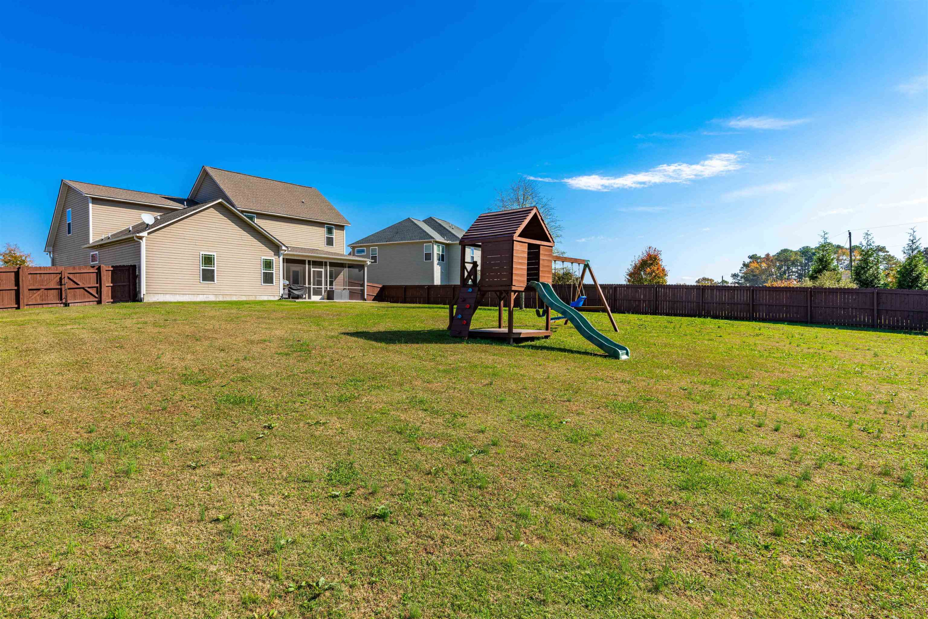 118 Colson Drive Garner, NC 27529 - Photo 44 of 47 a view of a house with a yard and sitting area