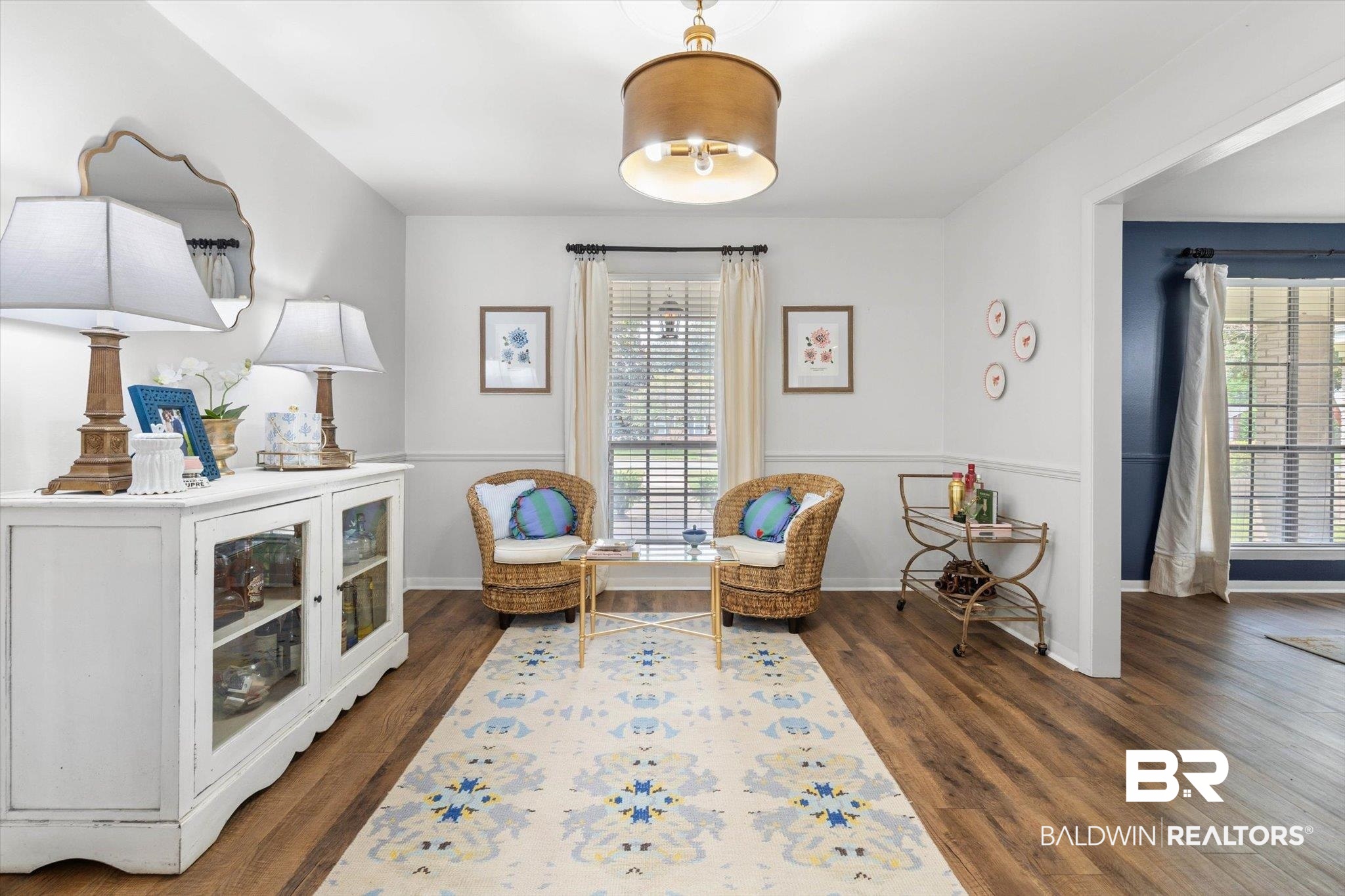 254 Woodlands Avenue Mobile, AL 36607 - Photo 12 of 50 Sitting room featuring plenty of natural light and dark wood-style floors