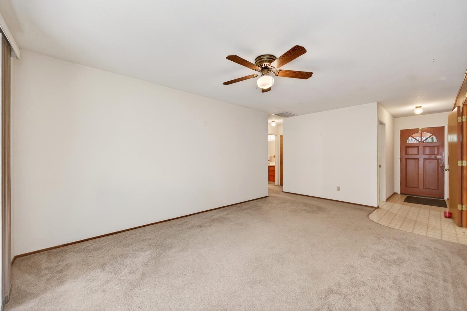 20191 Kit Court Volcano, CA 95689 - Photo 18 of 54 a view of a room with a ceiling fan and wooden floor