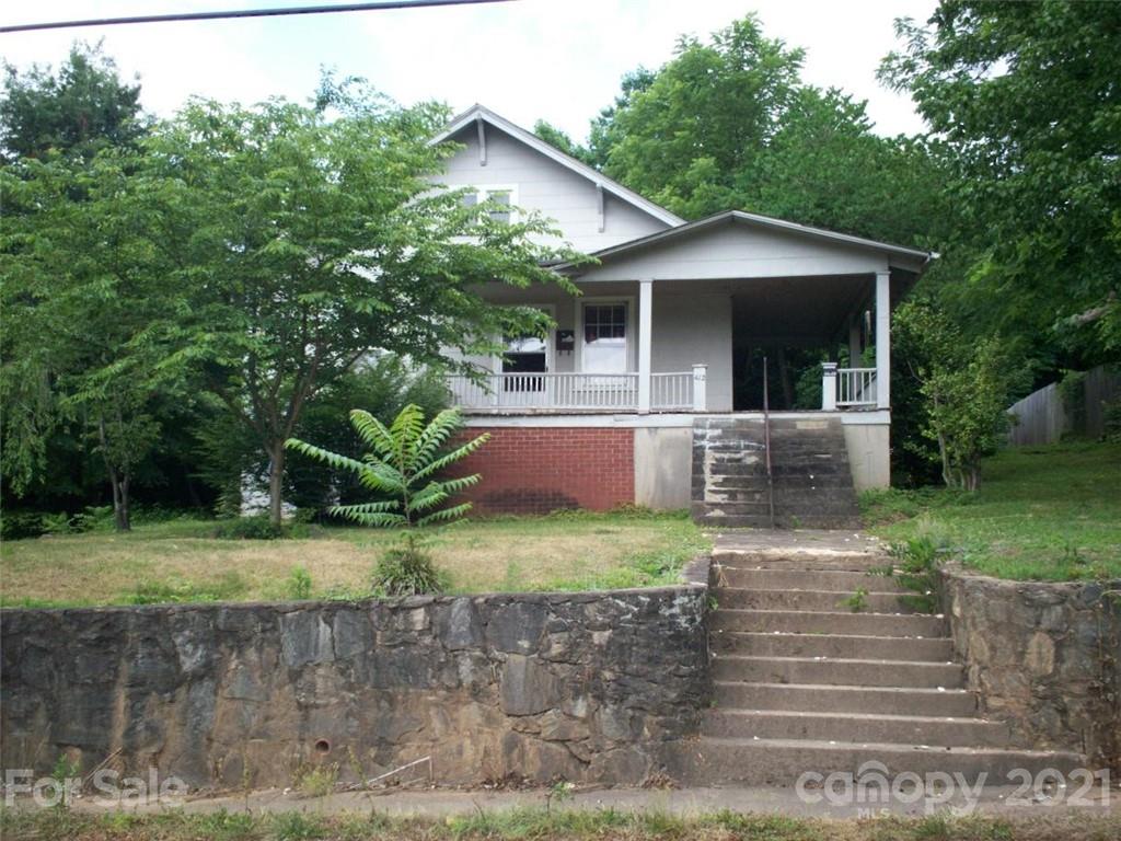 412 South Main Street Southwest Lenoir, NC 28645 - Photo 1 of 10 a front view of a house with garden