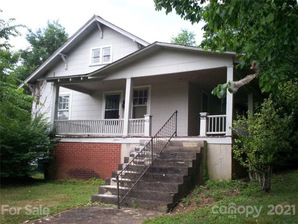 412 South Main Street Southwest Lenoir, NC 28645 - Photo 2 of 10 a front view of a house with garden