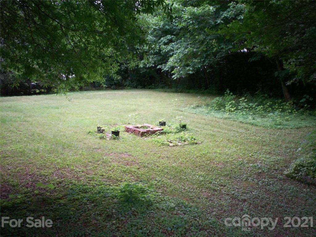 412 South Main Street Southwest Lenoir, NC 28645 - Photo 8 of 10 a backyard of a house with lots of green space