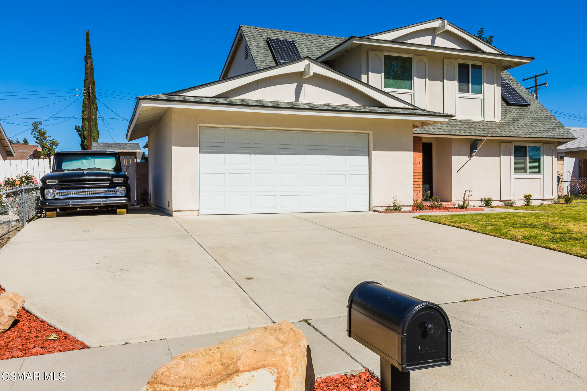 2149 Rhoda Street Simi Valley, CA 93065 - Photo 2 of 48 a front view of a house with a yard