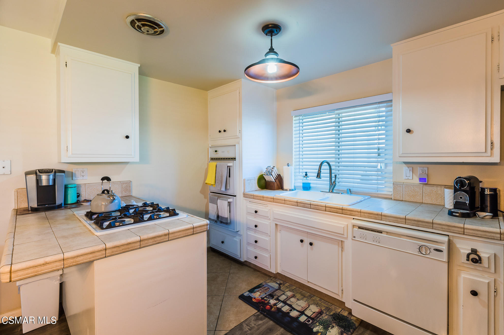 2149 Rhoda Street Simi Valley, CA 93065 - Photo 13 of 48 a kitchen with cabinets appliances a sink and a stove