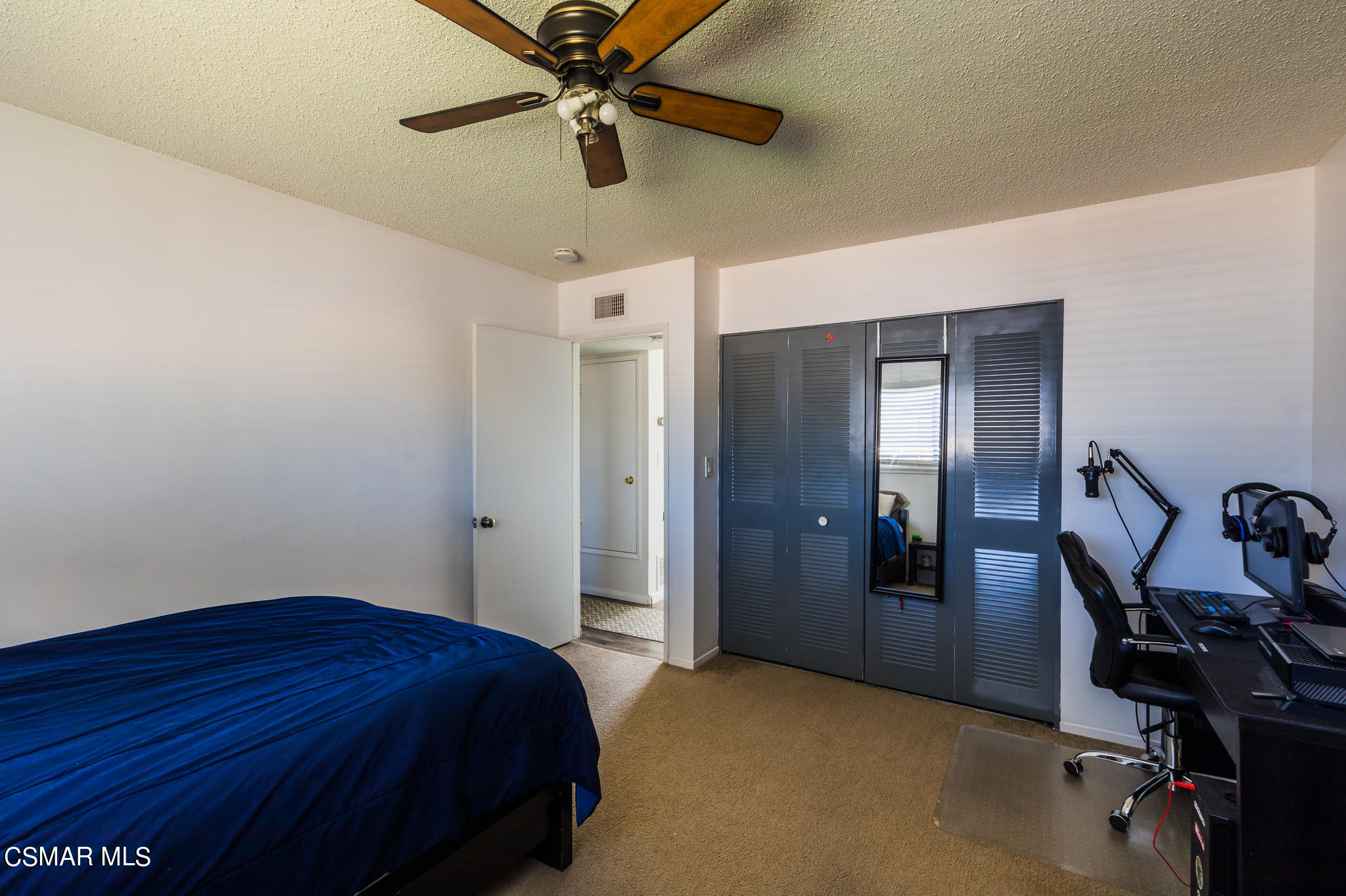 2149 Rhoda Street Simi Valley, CA 93065 - Photo 23 of 48 a bedroom with a bed and a chandelier