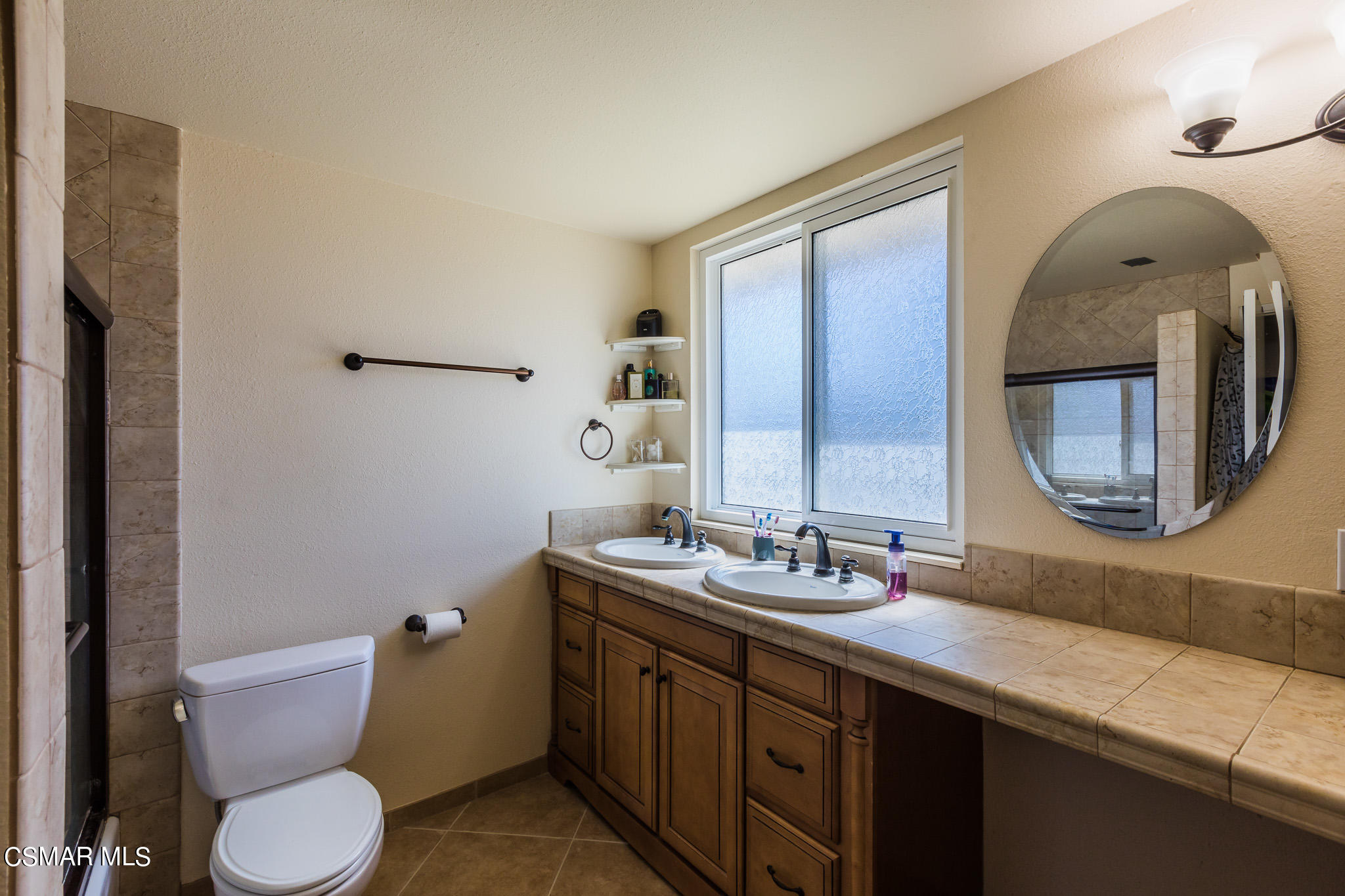 2149 Rhoda Street Simi Valley, CA 93065 - Photo 24 of 48 a bathroom with a granite countertop toilet sink and mirror
