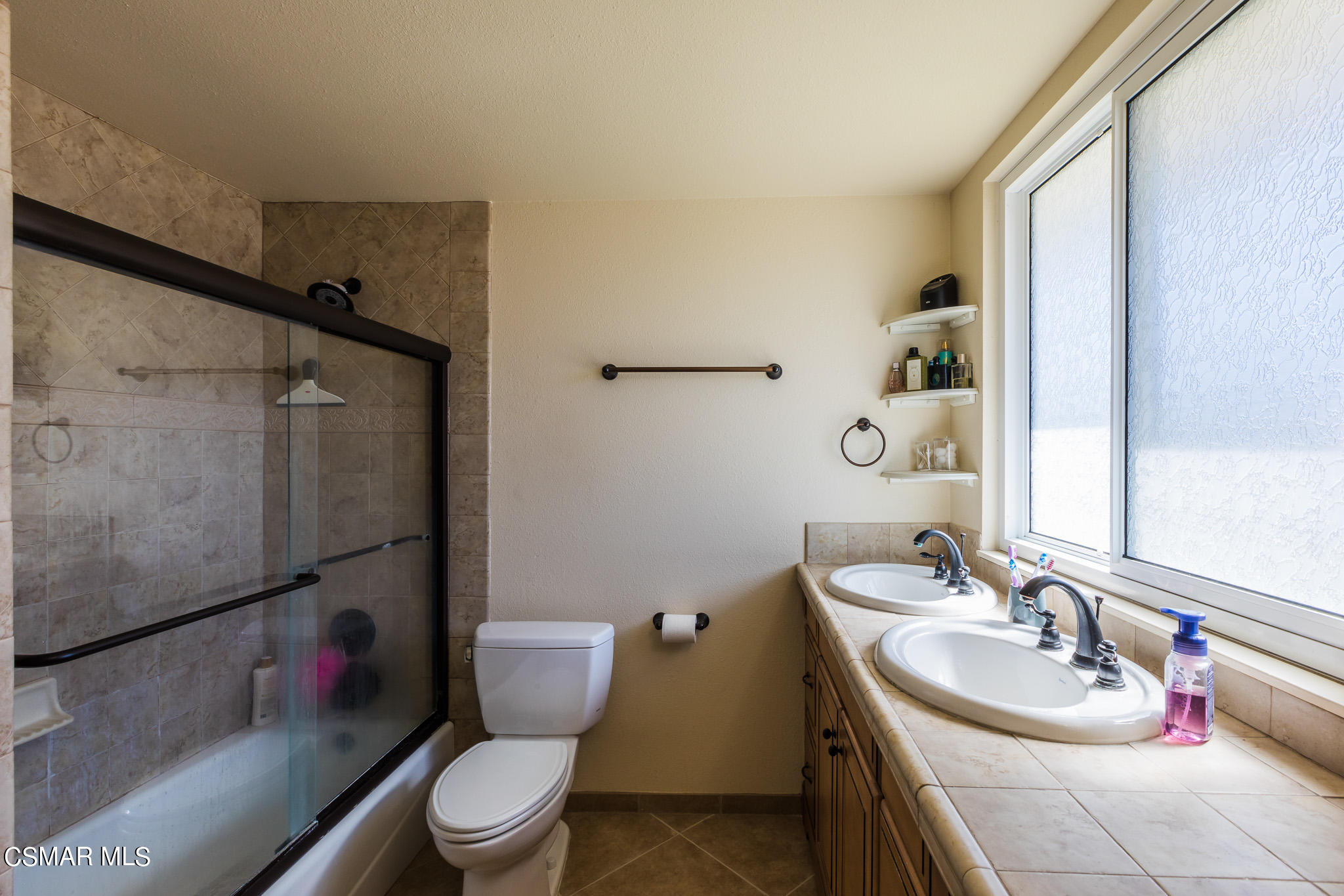 2149 Rhoda Street Simi Valley, CA 93065 - Photo 25 of 48 a bathroom with a sink toilet and shower