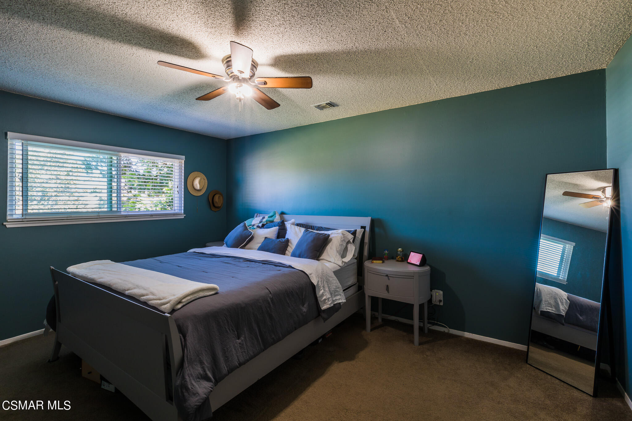 2149 Rhoda Street Simi Valley, CA 93065 - Photo 29 of 48 a bedroom with a bed and a chandelier