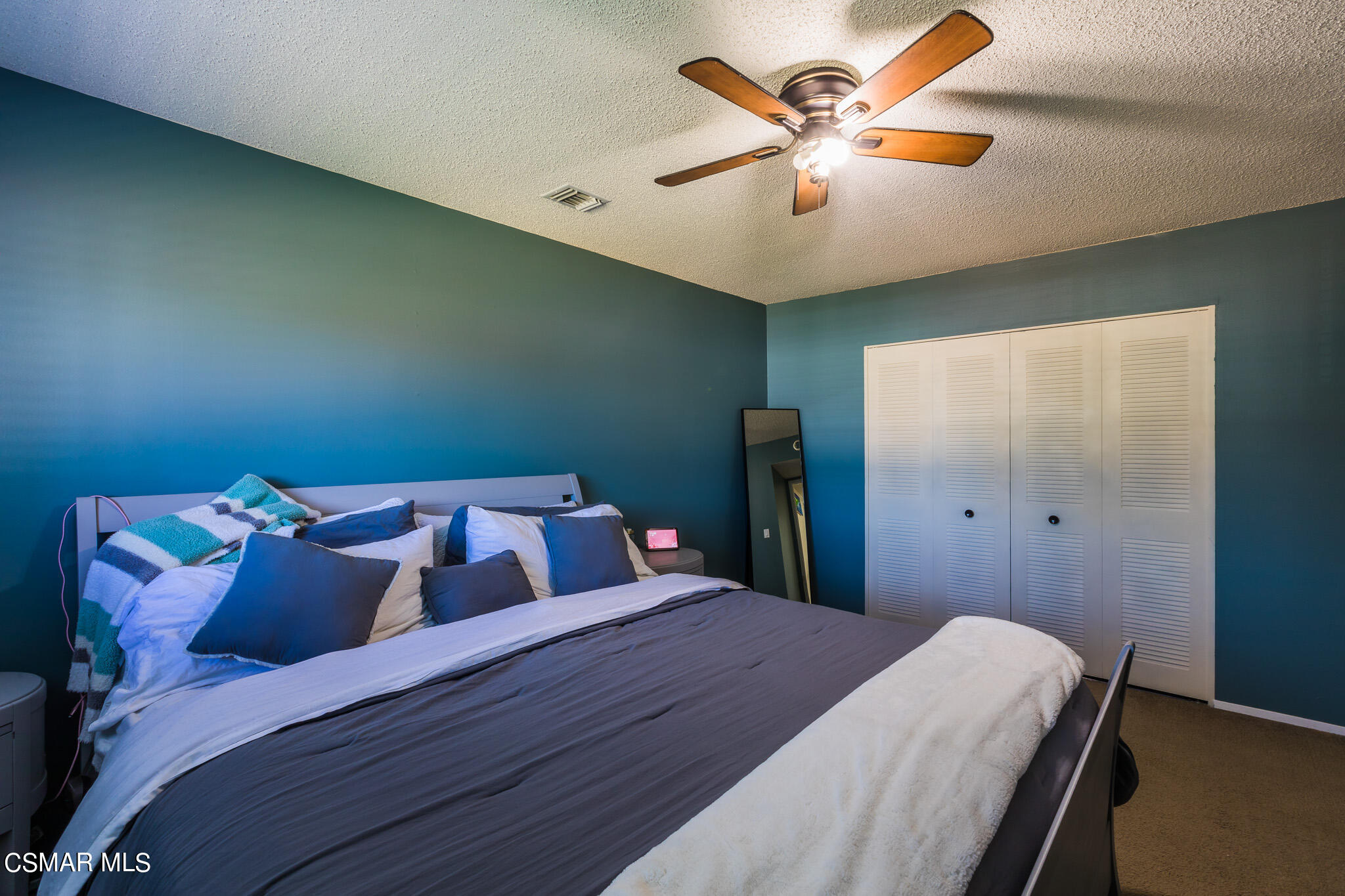 2149 Rhoda Street Simi Valley, CA 93065 - Photo 30 of 48 a bedroom with a bed and a ceiling fan