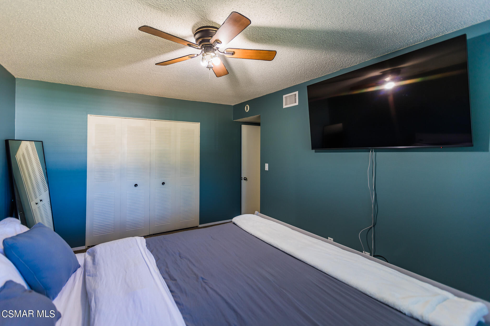 2149 Rhoda Street Simi Valley, CA 93065 - Photo 31 of 48 a bedroom with a large bed and a flat screen tv
