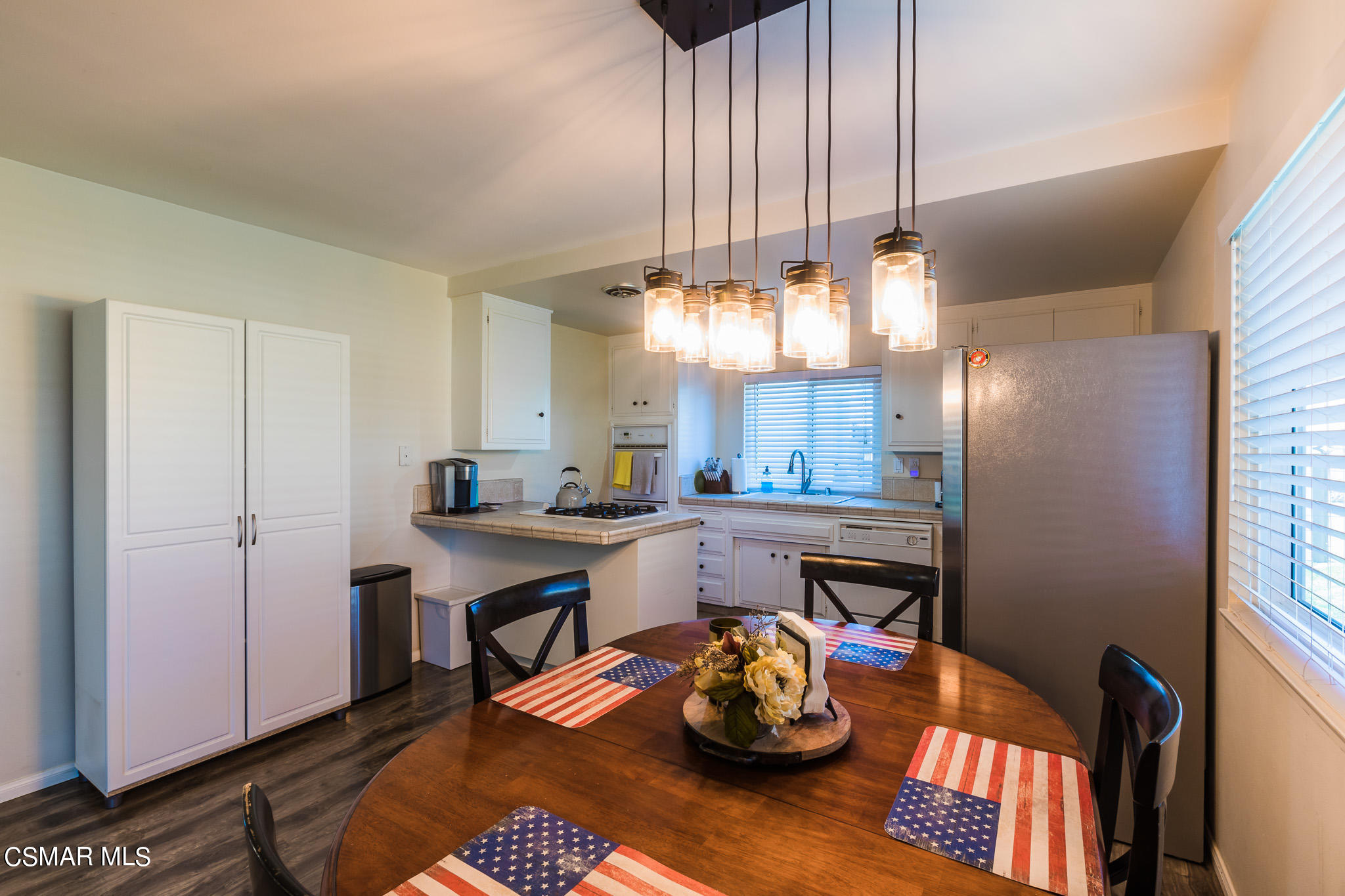 2149 Rhoda Street Simi Valley, CA 93065 - Photo 10 of 48 a kitchen with a table and chairs in it