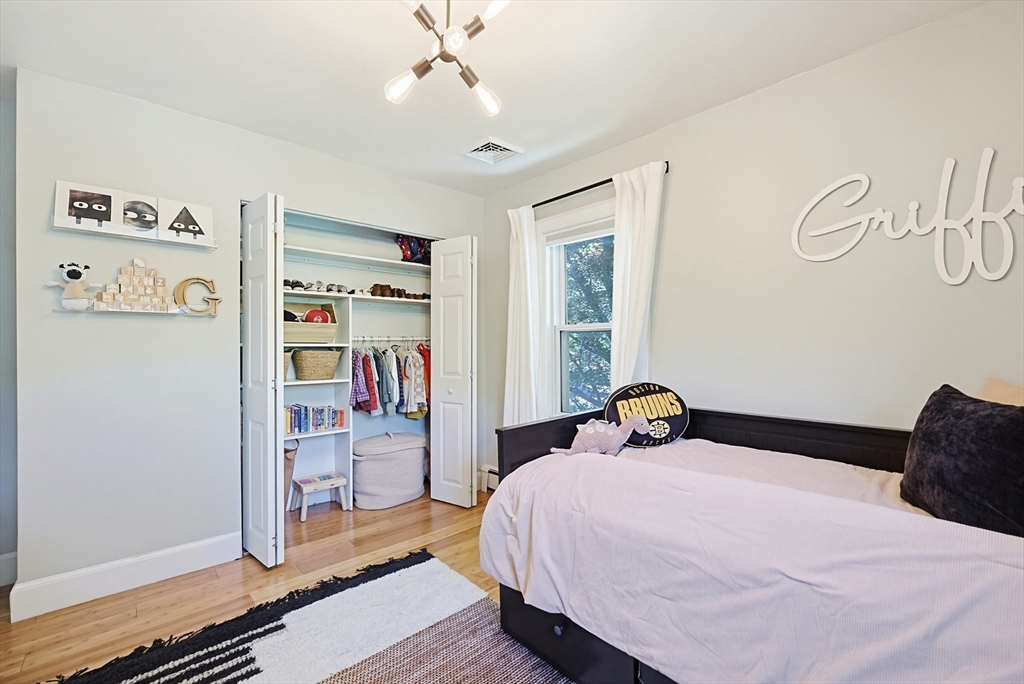 345 Sherman Street Canton, MA 02021 - Photo 27 of 42 a bedroom with a bed and a window