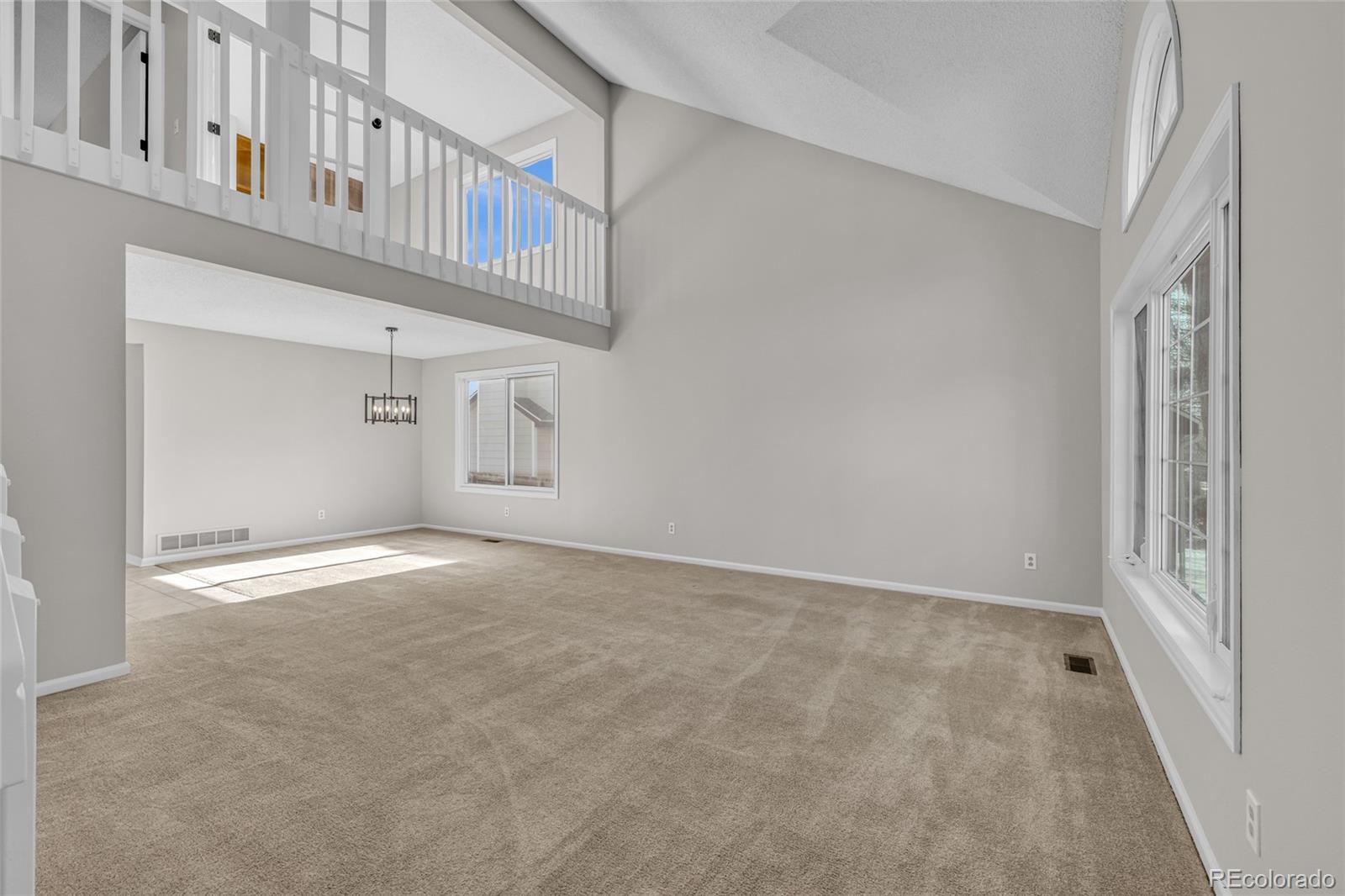 9390 Yale Lane Highlands Ranch, CO 80130 - Photo 12 of 50 a view of an empty room with staircase